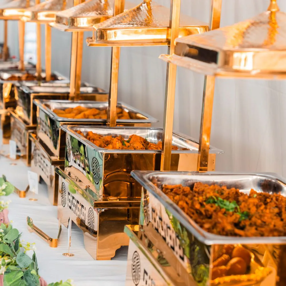 A line of event chafers set for buffet catering service